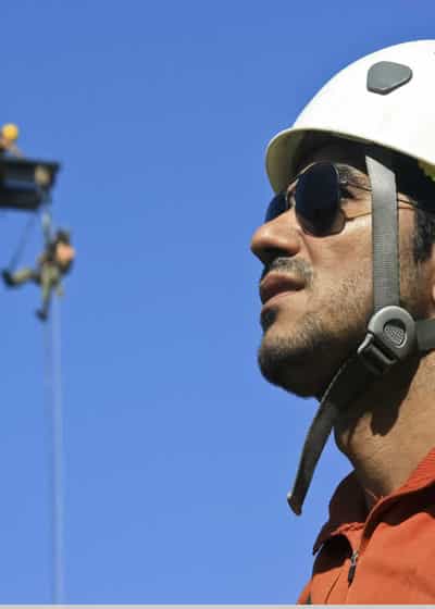 Rope access technician at height in wind energy